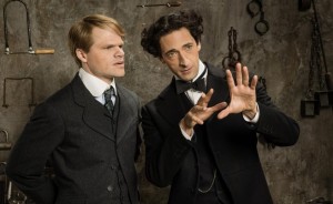 Evan Jones as Jim Collins and Adrien Brody as Harry Houdini.